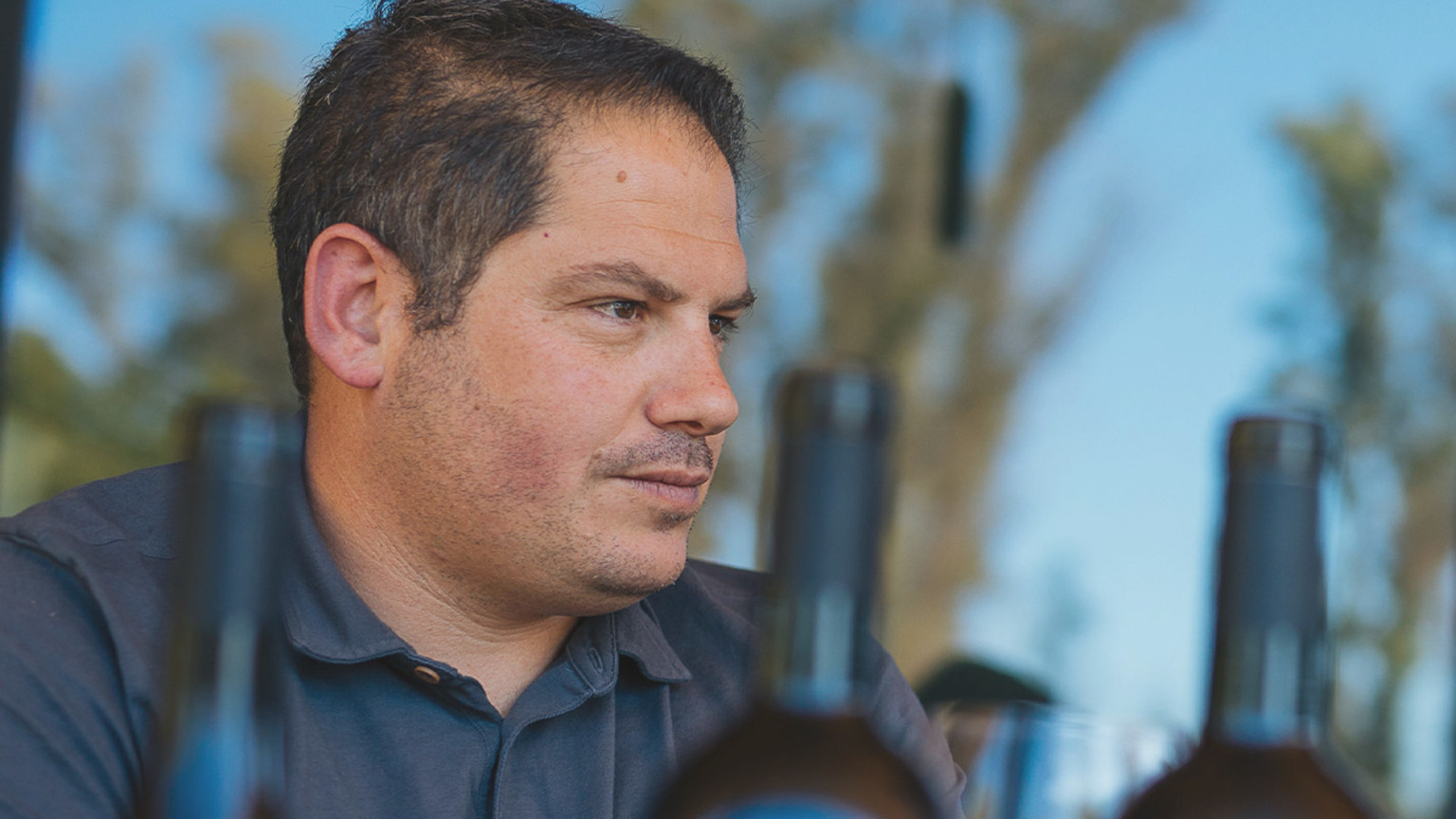 Winemaker Maayan Koschitzky tasting among Royal Prince bottles