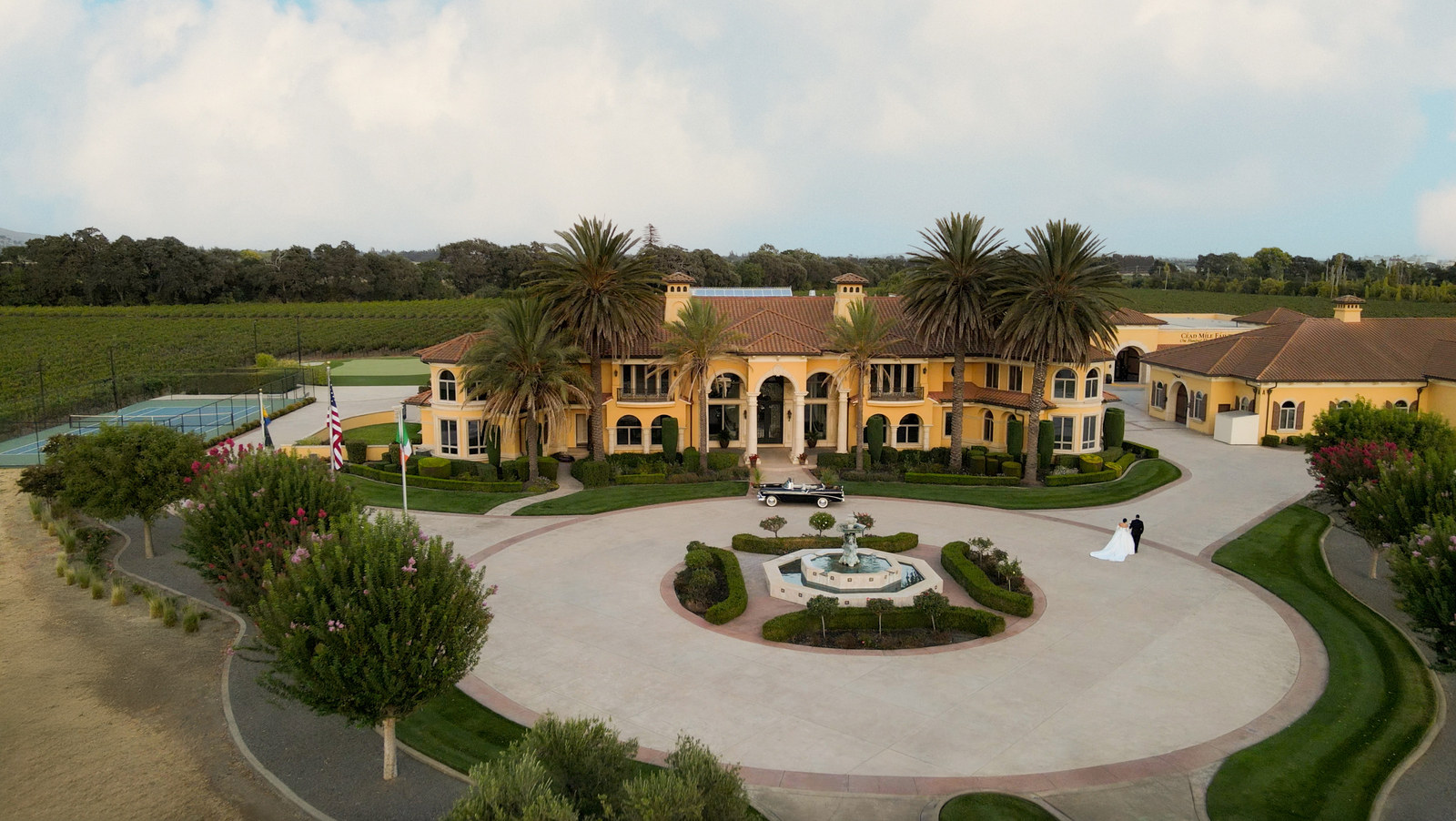 Aerial view of the Bally Keal Estate house, fountain court, and vineyard rows in Suisun Valley