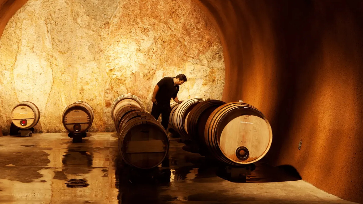 A person rolling a barrel in the Purlieu cave