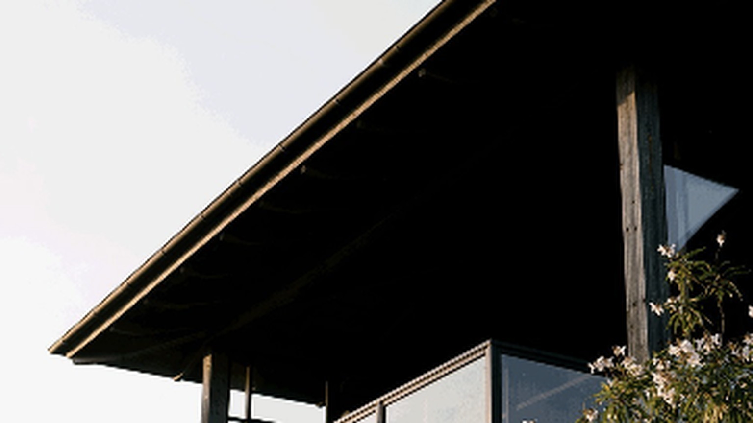 The Ovid winery building, with a balcony above the trees