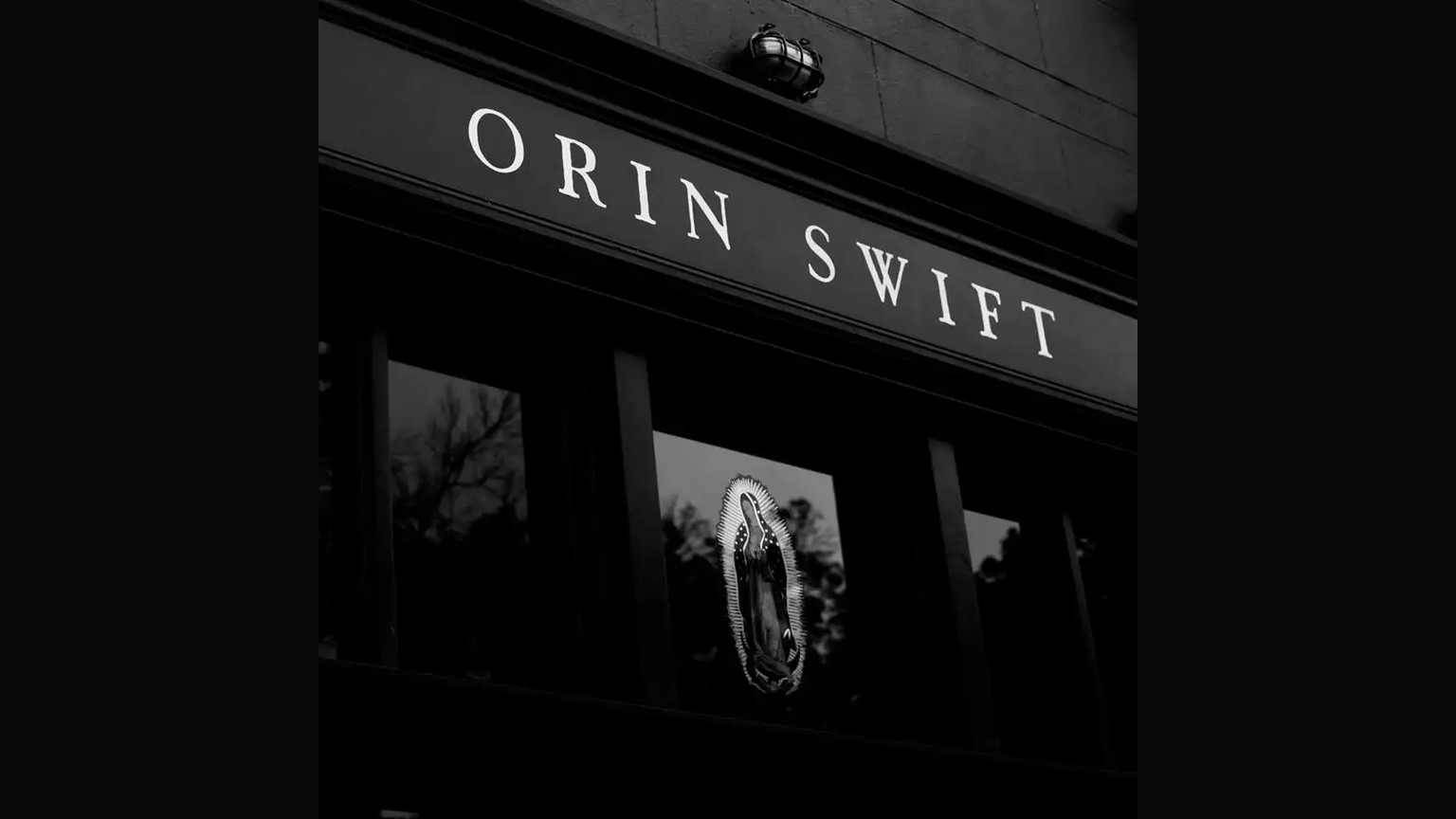 The Orin Swift sign above the tasting room window