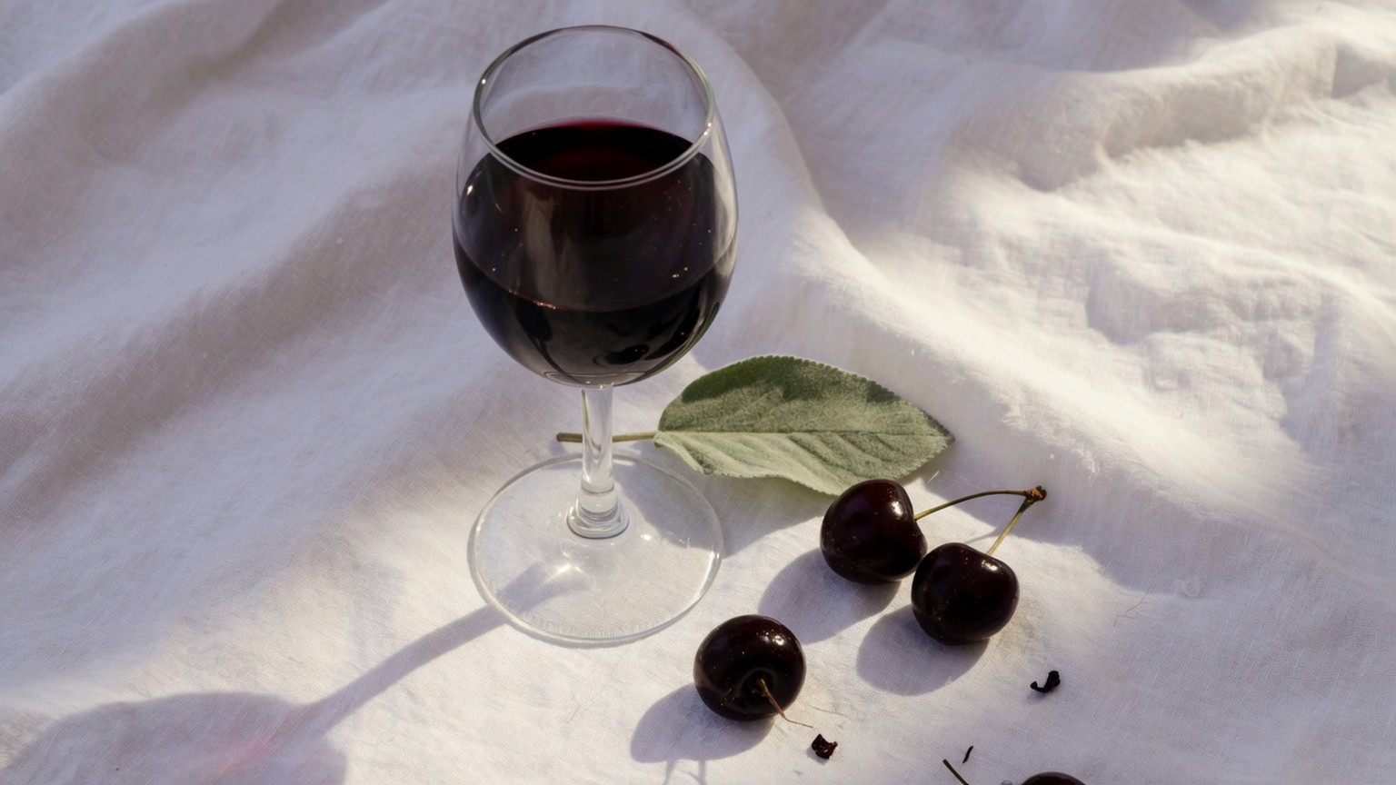 Generated still life, a glass of cabernet with black cherries and sage