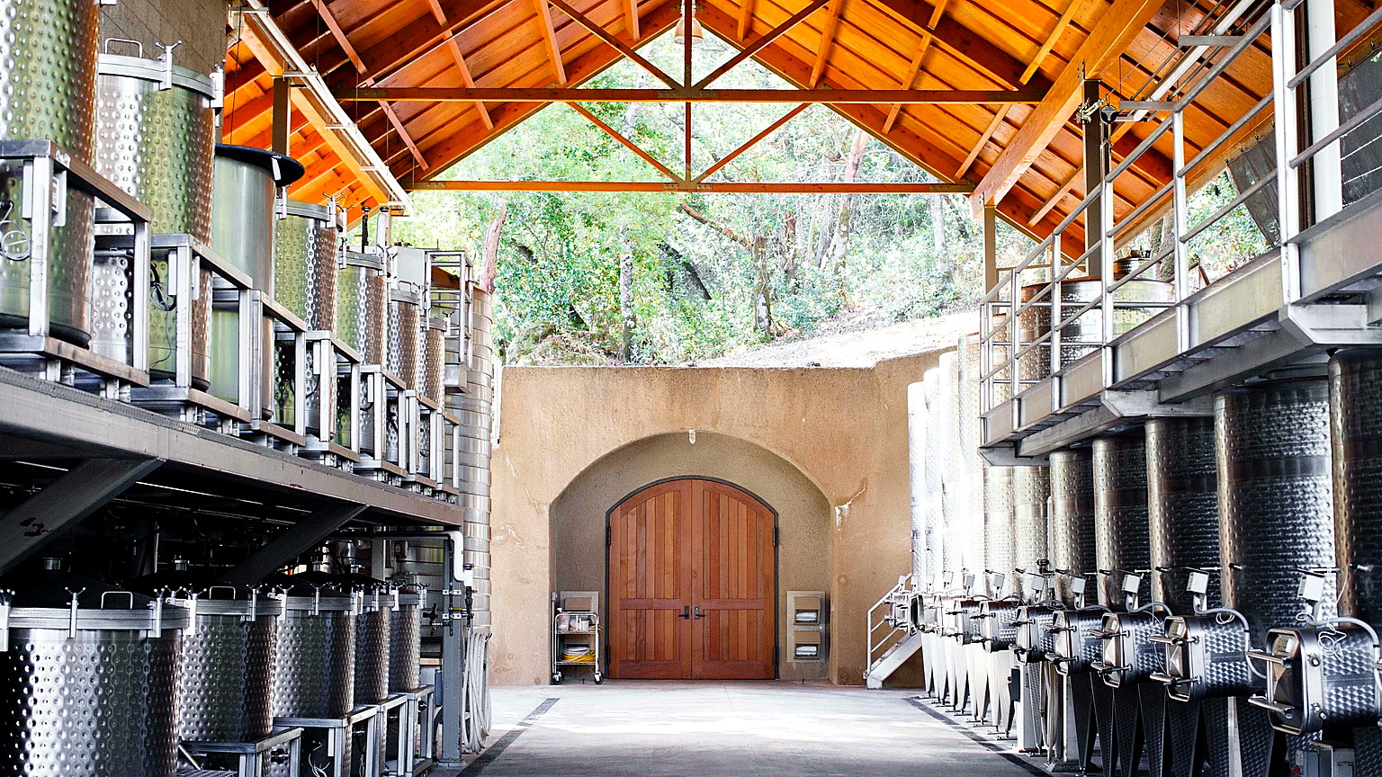 Stainless tanks in the open Hanzell winery toward the cave doors