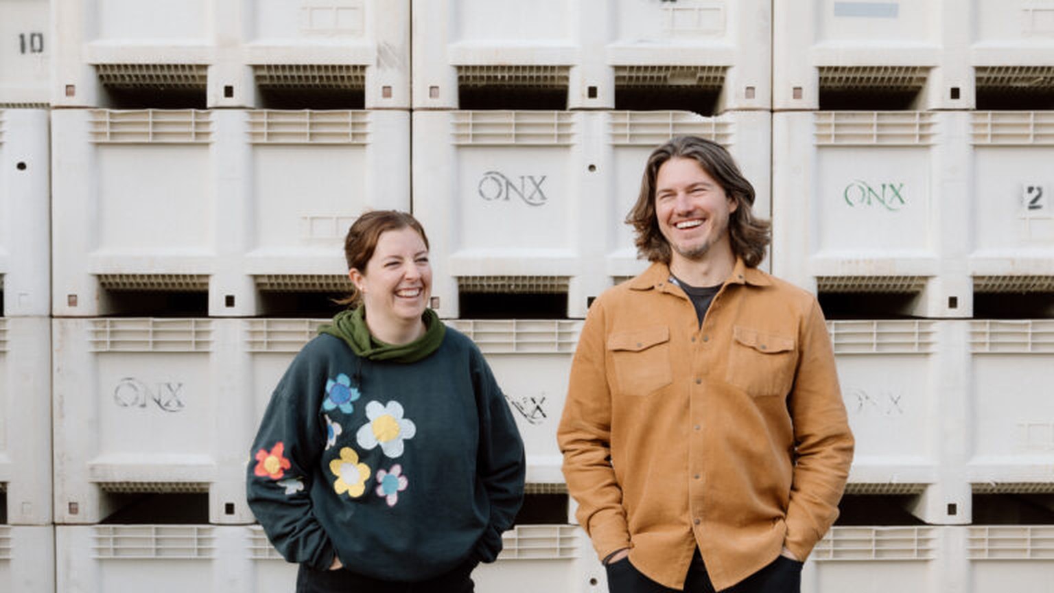 ONX winemakers Lauren Lange and Drew Nenow in front of harvest bins