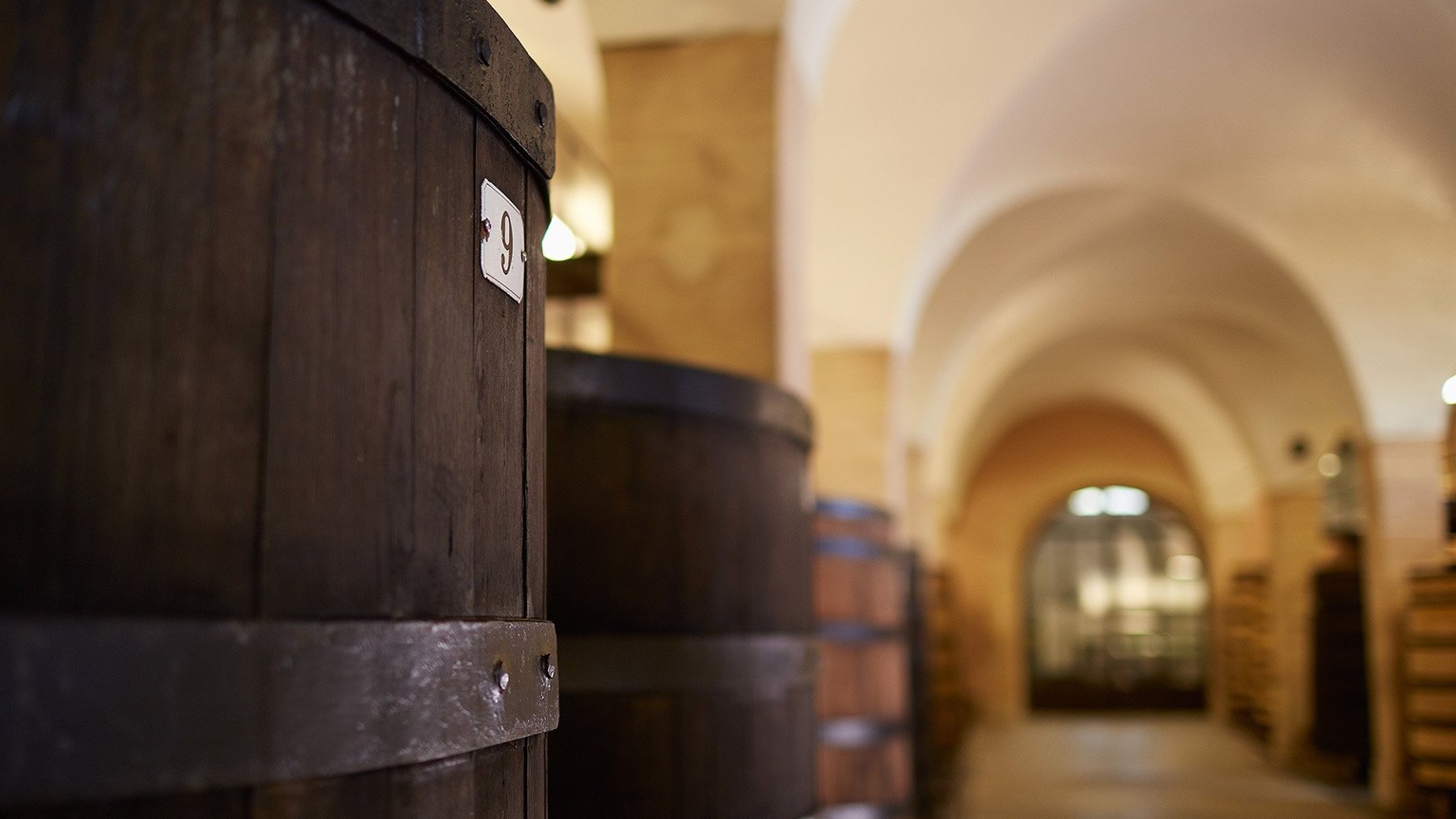 Large wooden casks in the Louis Latour cellars in Beaune
