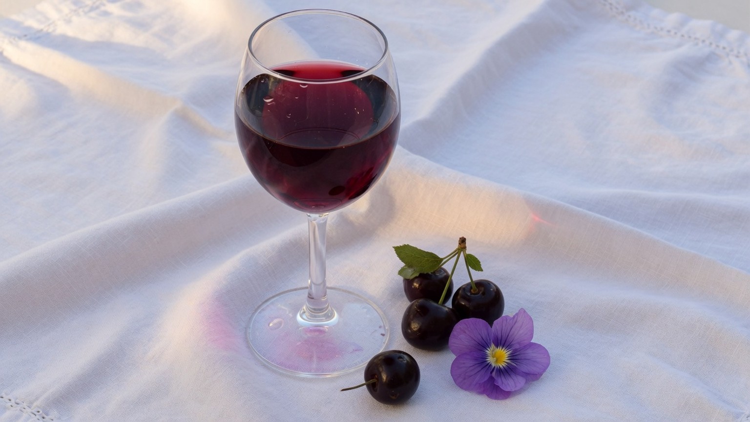 Generated still life, a glass of red wine with cherries