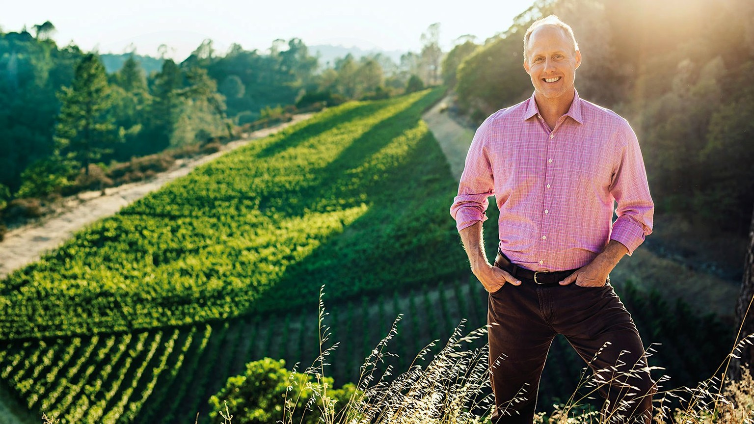 Thomas Rivers Brown standing above Napa vineyard rows at Outpost