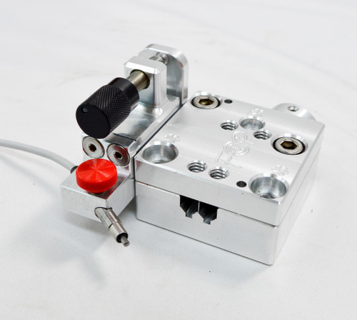 This bracket replaces the thumbscrew forward stop with a precision micrometer adjustment for repeatable neck depth settings and easier fine-tuning.