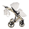 Side view of the Junama Candy Premium pram with the diamond carrycot. Shows frame detail, ventilation panel, and large wheels.