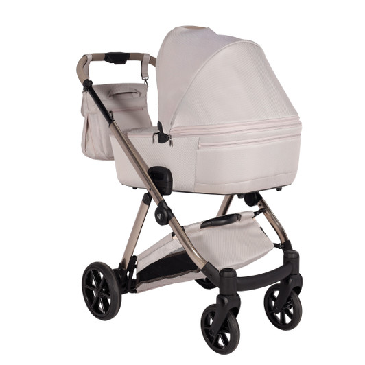 Rearview of the Junama Elegant pram with the diamond carrycot. Shows frame detail, rear design, one click handle and large wheels.