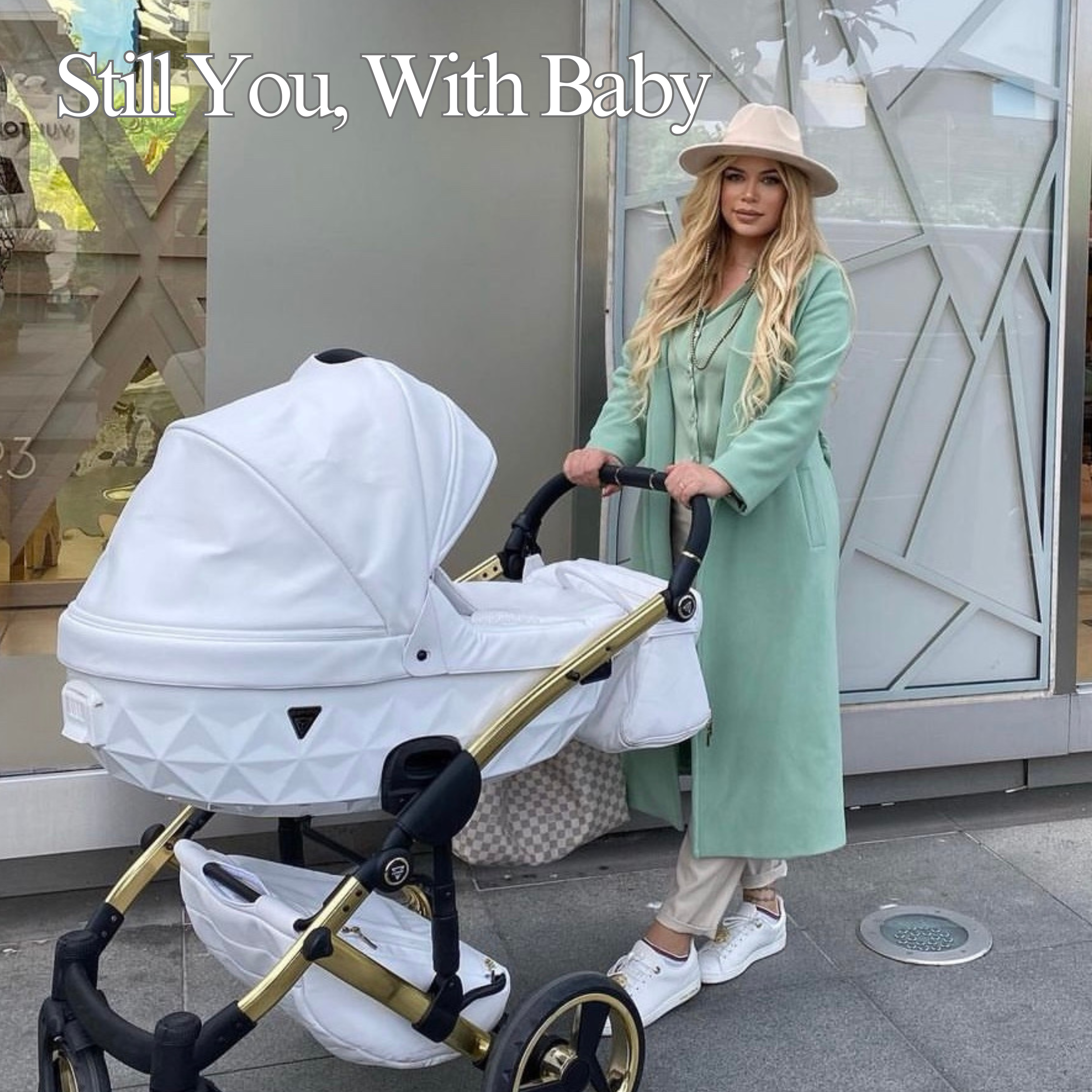 Modern parent walking with baby in Junama pram lifestyle setting