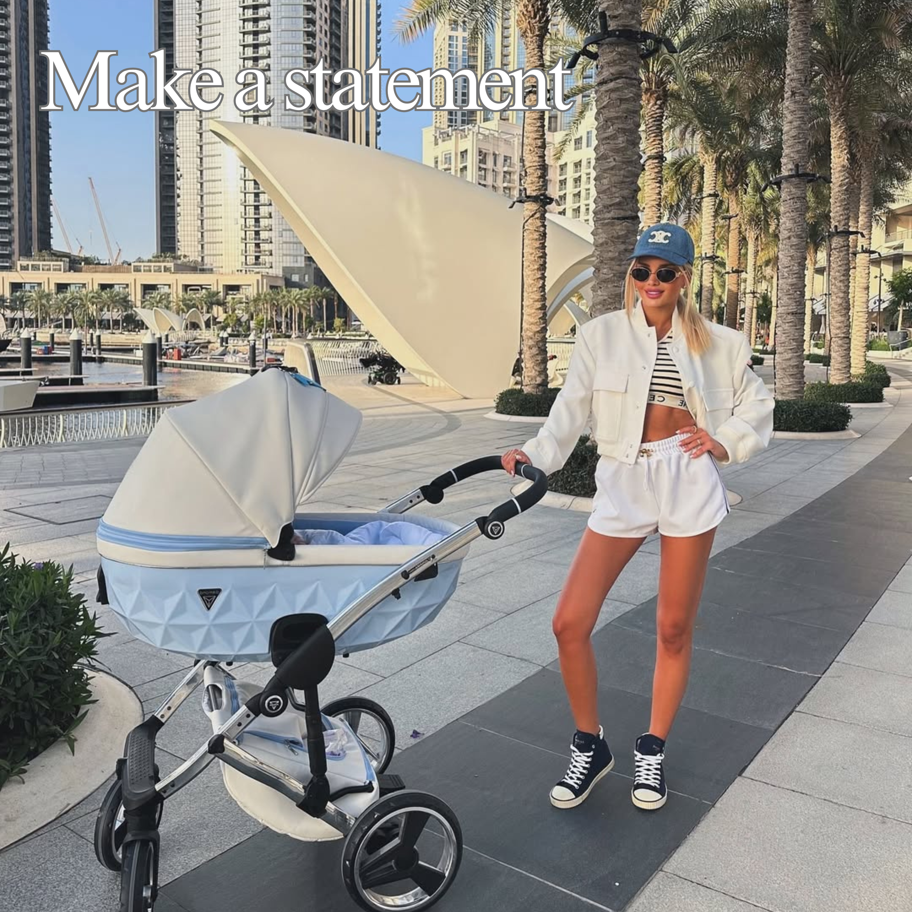 Statement luxury Junama pram used by parent during a city walk