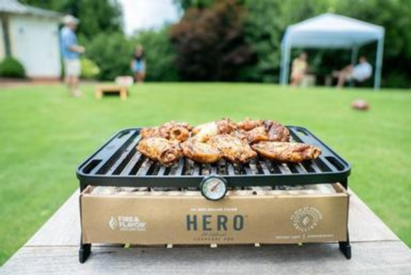 The Fire & Flavor HERO Grill is the world’s first environmentally friendly and premium portable grill that uses a biodegradable charcoal pod to make grilling clean, simple and highly portable. he grill is lightweight, foldable to the size of standard laptop and, better yet, is dishwasher friendly. HERO single-use charcoal pods are vacuum sealed and simple to dispose of or compost after each use. The charcoal pod is earth friendly in that it is comprised of cardboard, lava stones and all-natural, instant-light charcoal briquettes.