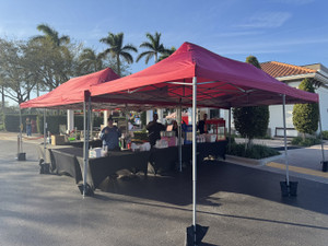 "A vibrant concession station with popcorn, cotton candy, and snacks at a carnival event." "A vibrant concession station with popcorn, cotton candy, and snacks at a carnival event."