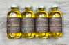 multiple bottles of Grapefruit Sandalwood Body Oil