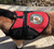 Miniature therapy horse wearing red vest with horseshoe Therapy Horse patch for clear identification