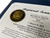 Close-up of official Registered Service Dog Certificate embossed gold seal and custom details