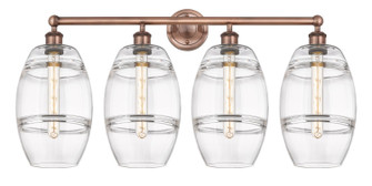 Edison Four Light Bath Vanity in Antique Copper (405|616-4W-AC-G557-8CL)