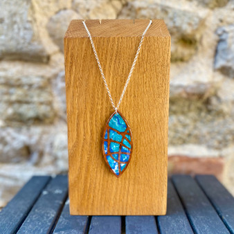 Walnut and Amboyna, real wood and sterling silver pendant is designed and made by Jason and Esme, Grange Gallery, Dorset.