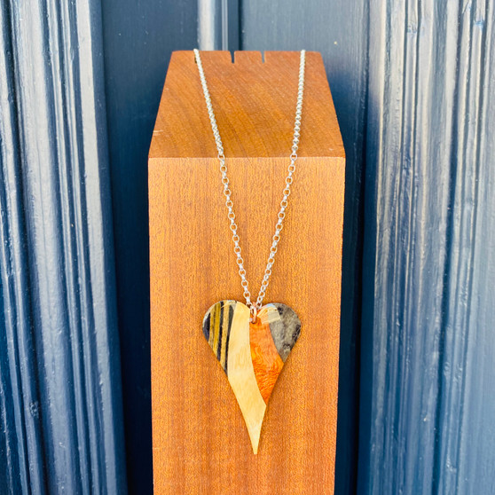 Heart  Pendant, real wood  mixed veneer,  finished with an acrylic glaze designed and made by Jason and Esme, Grange Gallery, Dorset