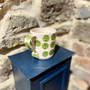 Ceramic mug with hand printed spot design by Jane Elmer-Smith, Grange Gallery, Dorset