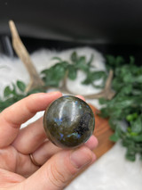 Labradorite Flashy Sphere for protection, intuition, and transformation. A beautiful polished crystal with striking natural flash.
