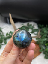 Labradorite Flashy Sphere for protection, intuition, and transformation. A beautiful polished crystal with striking natural flash.