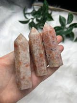 Wholesale set of 3 polished Sunstone points with peach and orange tones. Beautiful crystals for confidence, joy, vitality, creativity and uplifting energy.