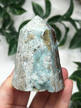 Hemimorphite tower with soft blue tones, raw matrix and natural druzy pockets.