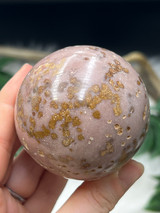 Beautiful Bubblegum Jasper sphere with soft pink tones and sparkling golden inclusions.