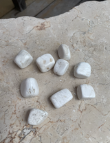 Scolecite Tumbled Stone with soft white natural patterning. A calming crystal for peace, sleep, meditation, emotional softness, intuition and higher spiritual connection.