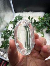 Shop this A Grade Clear Quartz Palmstone, featuring beautiful clarity and natural inclusions. A powerful crystal for focus, cleansing and energy amplification.