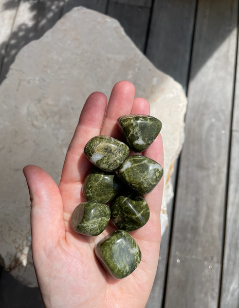 Rare Vesuvianite Tumbles with deep green earthy tones. A crystal for self-worth, emotional release, positive perspective, heart healing and personal growth.