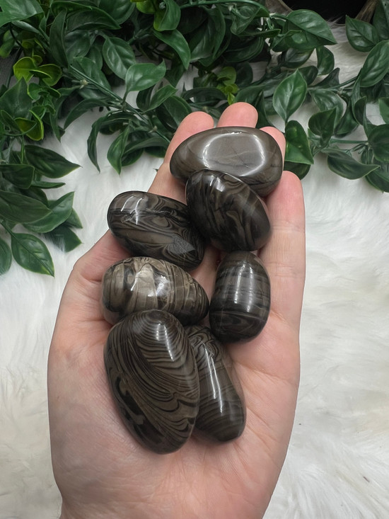 Hand Polished Swirling Flint Tumbled Stone with natural smoky banding. A grounding crystal for protection, cleansing, mental strength, emotional balance and Earth connection.
