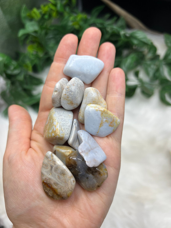 Blue Chalcedony Tumbled Stone with soft calming blue tones. A crystal for peaceful communication, emotional balance, throat chakra support, calm and gentle self-expression.