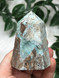 Hemimorphite tower with soft blue tones, raw matrix and natural druzy pockets.