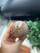 Beautiful Bubblegum Jasper sphere with soft pink tones and sparkling golden inclusions.