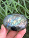 Labradorite palmstone for protection, intuition and transformation. A mystical crystal for energy shielding, spiritual awareness and inner magic.