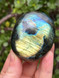 Labradorite palmstone for protection, intuition and transformation. A mystical crystal for energy shielding, spiritual awareness and inner magic.