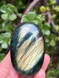 Labradorite palmstone for protection, intuition and transformation. A mystical crystal for energy shielding, spiritual awareness and inner magic.