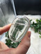 Shop this A Grade Clear Quartz Palmstone, featuring beautiful clarity and natural inclusions. A powerful crystal for focus, cleansing and energy amplification.