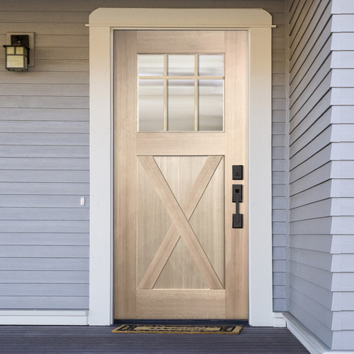 A light-colored wooden door with a grid of nine glass panes