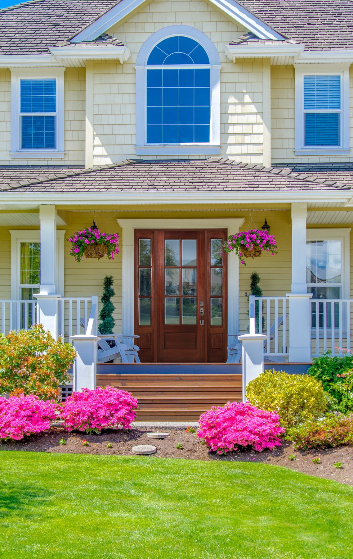 Mahogany 6-lite Knockety door with sidelites on a sunny porch