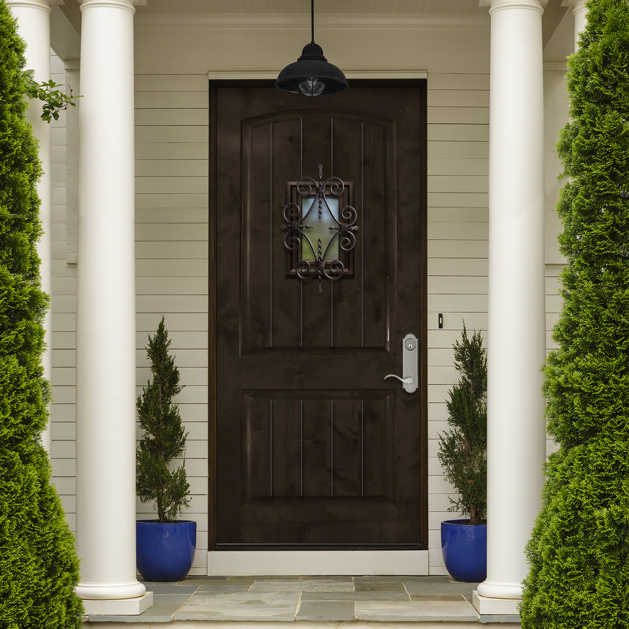 Charcoal finish on a Knotty Alder Solid 2 Panel Arch with Speakeasy door