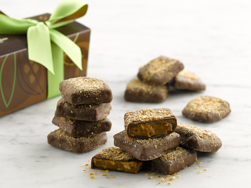 Almond Butter Crunch English Toffee with brown gift box tied with a green ribbon View Product Image