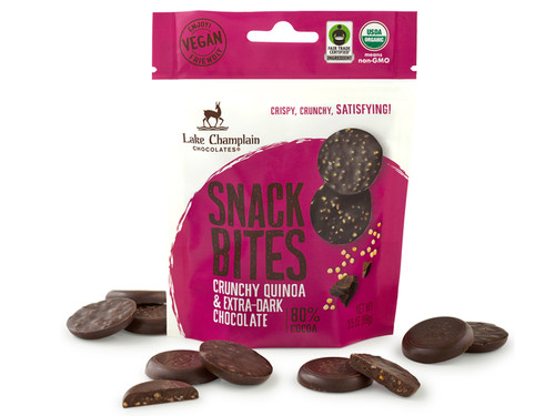 Extra dark chocolate snack bites with crunchy quinoa packaged in a resealable pink and white pouch