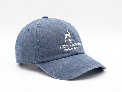 Lake Champlain Chocolates logo on a blue baseball cap with "Burlington, VT" on the back.