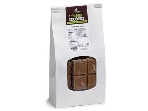 Factory seconds chocolate bars, broken and packaged in a white bag with a clear window in the front. View Product Image