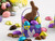 Milk chocolate Easter bunny in a paper box with chocolate eggs wrapped in colorful foils View Product Image