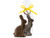 Organic 5" dark chocolate bunny wrapped in a clear gift bag with a yellow ribbon and a paper tag at the top with an unwrapped dark chocolate bunny next to it. View Product Image